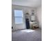 Bright bedroom with natural light features vanity, floor mirror, and neutral wall color at 4993 Birchland Manor Ave, Las Vegas, NV 89139
