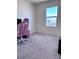 Empty room, with a large window and carpet at 4993 Birchland Manor Ave, Las Vegas, NV 89139