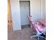 Bedroom featuring closet with a sliding door and a comfortable chair with a desk at 4993 Birchland Manor Ave, Las Vegas, NV 89139