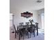 Dining room with table set and a sliding glass door to the backyard at 4993 Birchland Manor Ave, Las Vegas, NV 89139