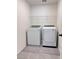Clean and efficient laundry room equipped with modern washer and dryer units and storage at 4993 Birchland Manor Ave, Las Vegas, NV 89139
