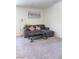 Living room with a gray sectional sofa and a dark gray coffee table at 4993 Birchland Manor Ave, Las Vegas, NV 89139