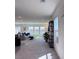 Bright living room with plush carpet, natural light, and modern decor at 4993 Birchland Manor Ave, Las Vegas, NV 89139
