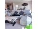 Cozy living room featuring a plush sectional sofa, stylish marble coffee table, and modern decor at 4993 Birchland Manor Ave, Las Vegas, NV 89139
