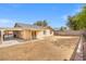 Expansive backyard with a covered patio, carport, and block wall, offering space and privacy at 5001 Morris St, Las Vegas, NV 89122