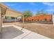 Spacious backyard with a covered patio and a wooden fence at 5001 Morris St, Las Vegas, NV 89122