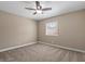 Empty bedroom with neutral carpet, ceiling fan, and a window at 5001 Morris St, Las Vegas, NV 89122