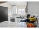 Updated kitchen featuring white cabinets, granite countertops, and stainless steel appliances at 5001 Morris St, Las Vegas, NV 89122
