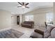 Spacious living room with tile floors, neutral walls, and large windows providing plenty of natural light at 5001 Morris St, Las Vegas, NV 89122