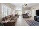 Bright and airy living room featuring tile floors, large windows, and an open layout perfect for entertaining at 5001 Morris St, Las Vegas, NV 89122