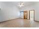 Large bedroom with tile floors, fan, window and access to bathroom and closet at 5029 Pacific Grove Dr, Las Vegas, NV 89130