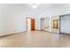 Spacious bedroom with tile floors, ceiling fan, and mirrored closet doors provides ample storage at 5029 Pacific Grove Dr, Las Vegas, NV 89130