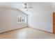 Well lit bedroom with tile floors, shuttered window and neutral paint at 5029 Pacific Grove Dr, Las Vegas, NV 89130