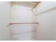 Image of a walk-in closet with a wooden dowel and white walls at 5029 Pacific Grove Dr, Las Vegas, NV 89130
