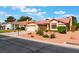 Charming single-story home featuring a well-manicured front yard, two-car garage, and desert landscaping at 5029 Pacific Grove Dr, Las Vegas, NV 89130