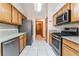 Modern kitchen featuring stainless steel appliances, light wood cabinets, and tiled floors for a clean look at 5029 Pacific Grove Dr, Las Vegas, NV 89130