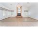 Bright living room featuring a brick fireplace, tiled floors, and neutral paint at 5029 Pacific Grove Dr, Las Vegas, NV 89130