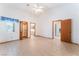 Bright main bedroom with vaulted ceilings, tiled floors, and multiple doors for convenient access and closet space at 5029 Pacific Grove Dr, Las Vegas, NV 89130