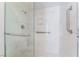 Close up of frameless glass shower with grab bars and shower head at 5029 Pacific Grove Dr, Las Vegas, NV 89130
