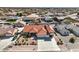 Aerial view of a home showcasing a well-maintained yard, RV parking, and a tile roof at 5231 E Chasemoor St, Pahrump, NV 89061