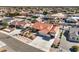 Aerial view of a neighborhood showcasing houses with pools and well-maintained lawns at 5231 E Chasemoor St, Pahrump, NV 89061