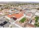 Bird's-eye view of a charming residence featuring a lush backyard with artificial turf, nestled in a quiet neighborhood at 5231 E Chasemoor St, Pahrump, NV 89061