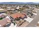 An aerial view showing the property's tile roof, fenced backyard and pool, located in a quiet neighborhood at 5231 E Chasemoor St, Pahrump, NV 89061