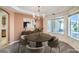 Cozy dining area featuring a modern chandelier and neutral-toned decor at 5231 E Chasemoor St, Pahrump, NV 89061