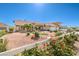 Charming single story home featuring a spacious front yard, three car garage and colorful rose bushes at 5231 E Chasemoor St, Pahrump, NV 89061