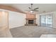 Open-concept living space with stone fireplace at 5231 E Chasemoor St, Pahrump, NV 89061
