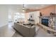 Inviting living room featuring a stone fireplace and a neutral color palette at 5231 E Chasemoor St, Pahrump, NV 89061