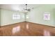 Light and airy main bedroom with vaulted ceilings, ceiling fan, and wood laminate flooring at 5231 E Chasemoor St, Pahrump, NV 89061