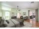 Light and airy main bedroom with hardwood floors, ensuite bathroom and sliding door access to backyard at 5231 E Chasemoor St, Pahrump, NV 89061