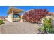 Backyard featuring RV parking with a covered area, mature trees, and gravel landscaping at 5231 E Chasemoor St, Pahrump, NV 89061