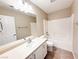 Well-lit bathroom featuring single sink vanity, large mirror, tiled floor, and shower-tub combination at 5271 Aurora Beam Ave, Las Vegas, NV 89122