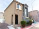 Inviting two-story home featuring a neutral stucco facade, complemented by well-kept landscaping at 5271 Aurora Beam Ave, Las Vegas, NV 89122