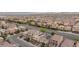 Expansive aerial view of a suburban neighborhood featuring well-maintained homes with desert landscaping and tile roofs at 5409 Holding Ave, Las Vegas, NV 89139