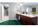 The well-lit bathroom features a double sink vanity and a walk-in closet, providing ample space and storage at 5409 Holding Ave, Las Vegas, NV 89139