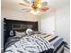 Comfortable bedroom featuring a luxurious bed, soft lighting, and a ceiling fan for a relaxing ambiance at 5409 Holding Ave, Las Vegas, NV 89139