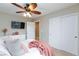 Well-lit bedroom with large windows, neutral carpet, and ample closet space at 5409 Holding Ave, Las Vegas, NV 89139