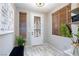 Bright entryway with decorative tile flooring, a stylish door, and modern accents at 5409 Holding Ave, Las Vegas, NV 89139