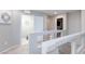 Second floor hallway with railing overlooking the lower level at 5409 Holding Ave, Las Vegas, NV 89139