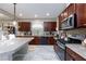Modern kitchen with granite countertops, stainless steel appliances, and ample cabinet space at 5409 Holding Ave, Las Vegas, NV 89139