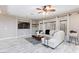 Stylish living room featuring a white sofa, a large TV, and neutral decor at 5409 Holding Ave, Las Vegas, NV 89139