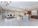 Expansive living room with modern decor, recessed lighting, and tile floors at 5409 Holding Ave, Las Vegas, NV 89139