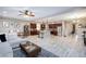 Expansive open-concept living space features a modern kitchen, dining area, and comfortable living room at 5409 Holding Ave, Las Vegas, NV 89139