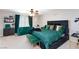 This is a well-lit room with a ceiling fan, green accents, and an integrated sofa and bench set at 5409 Holding Ave, Las Vegas, NV 89139