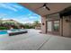 Backyard with swimming pool, spa, patio, and desert landscaping at 6012 Chessington Ave, Las Vegas, NV 89131