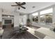 Bright living room with large windows overlooking the pool, modern decor, and a comfortable seating area at 6012 Chessington Ave, Las Vegas, NV 89131