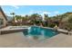 Swimming pool and spa featuring waterfalls, stone surround, and fire bowls at 6012 Chessington Ave, Las Vegas, NV 89131